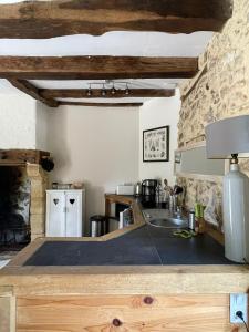 a kitchen with a sink and a counter top at La Serva in Les Lèches