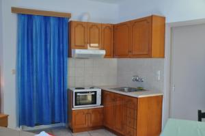 Kuchyň nebo kuchyňský kout v ubytování Lydia Rooms & Studios