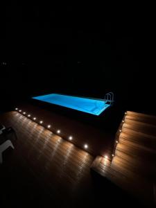 a blue tub on a wooden deck with lights at Villa Visocchi Bed and Breakfast in Atina +38 photos