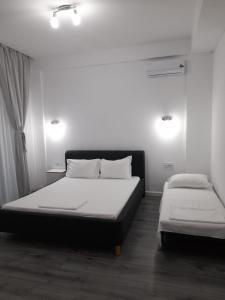 Postel nebo postele na pokoji v ubytování Vila SEA VIBES