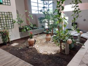 Vonkajšia záhrada v ubytovaní Superbe appartement cosy - Plage des minimes