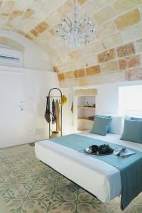 Ένα ή περισσότερα κρεβάτια σε δωμάτιο στο La Volpe e l'Uva