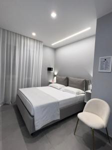 Ένα ή περισσότερα κρεβάτια σε δωμάτιο στο CUORE - LUXURY ROOMS