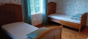 Postel nebo postele na pokoji v ubytování Månsarps skogs- och alpackagård