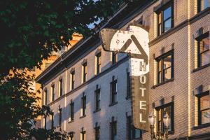 a building with a sign on the side of it at The Clyde Hotel Portland by Kasa Living in Portland