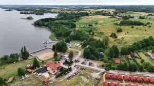 an aerial view of a resort next to a lake at Całoroczny dom nad Jeziorem in Rukławki