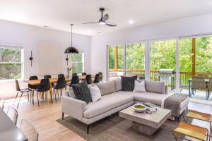 a living room with a couch and a table at Sleek Tennessee Retreat 2 Mi to Center Hill Lake! in Lancaster