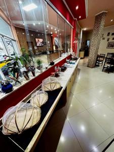 a buffet line in a restaurant with bowls on it at Hotel Bis in São Bernardo do Campo