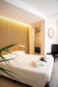 Postel nebo postele na pokoji v ubytování Suites Mediterranèè