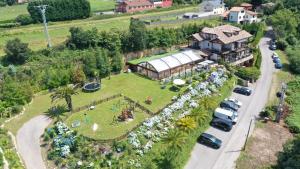 an aerial view of a house with a garden at Hotel Rural Playa de Aguilar in Muros de Nal&oacute;n