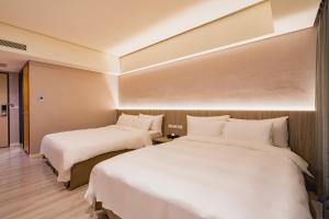 Katil atau katil-katil dalam bilik di 家美瑞品 台北 - Jiamei Hotel