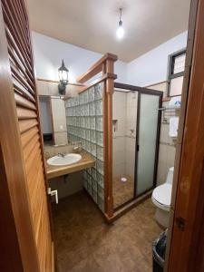 a bathroom with a sink and a toilet at Hotel & Balneario Los Angeles in Taxco de Alarcón +72 photos