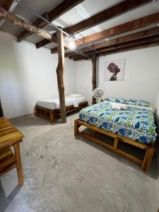 Postel nebo postele na pokoji v ubytování Cabañas W Beach
