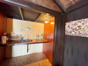 a small kitchen with a sink and a counter at Beach Shack Tioman - Beachfront Seaview in Tioman Island