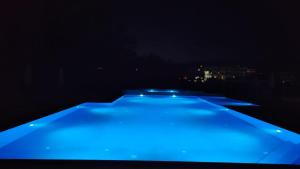 a row of blue lights in the dark at Lula Apartments in Ulcinj