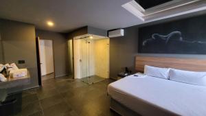 Postel nebo postele na pokoji v ubytování 4Play Motel