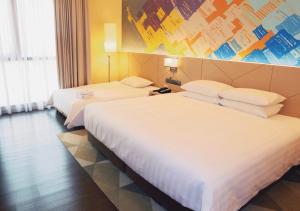 Postel nebo postele na pokoji v ubytování Sunway Hotel Big Box
