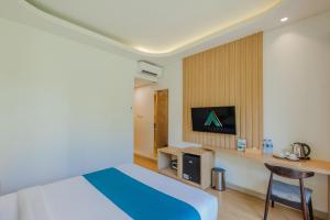 Ein Bett oder Betten in einem Zimmer der Unterkunft ABISHA Hotel Sanur