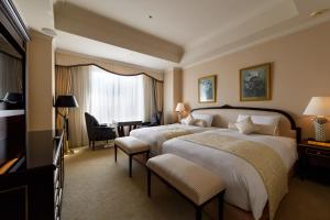 Cama ou camas em um quarto em Dai-ichi Hotel Tokyo