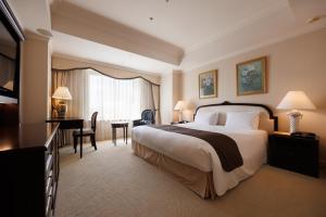Cama ou camas em um quarto em Dai-ichi Hotel Tokyo