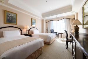 Cama ou camas em um quarto em Dai-ichi Hotel Tokyo