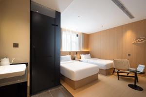 Shanghai Captain 5 Youth Hotel - Xinzhuang Metro Station 객실 침대