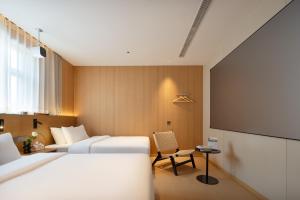 Shanghai Captain 5 Youth Hotel - Xinzhuang Metro Station 객실 침대