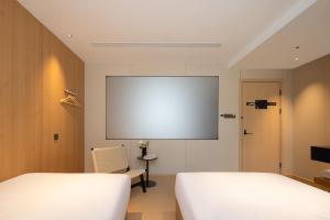 Shanghai Captain 5 Youth Hotel - Xinzhuang Metro Station 객실 침대