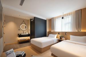 Shanghai Captain 5 Youth Hotel - Xinzhuang Metro Station 객실 침대