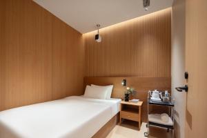 Shanghai Captain 5 Youth Hotel - Xinzhuang Metro Station 객실 침대