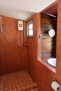a bathroom with a shower and a sink at Banjai Garden Guesthouse in Chiang Mai +15 photos