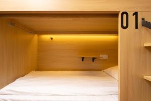 Shanghai Captain 5 Youth Hotel - Xinzhuang Metro Station 객실 침대