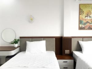 Postel nebo postele na pokoji v ubytování KING HOTEL