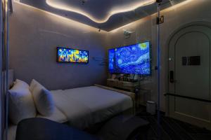 TV a/nebo společenská místnost v ubytování Pynt Hotel 2