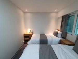 Beyond Residence Jongnoにあるベッド
