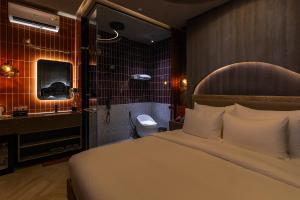 Postel nebo postele na pokoji v ubytování Pynt Hotel 2