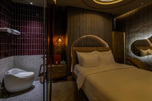 Postel nebo postele na pokoji v ubytování Pynt Hotel 2