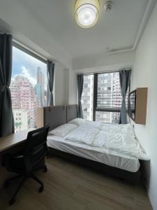 Ένα ή περισσότερα κρεβάτια σε δωμάτιο στο China Rich Oriental Hotel
