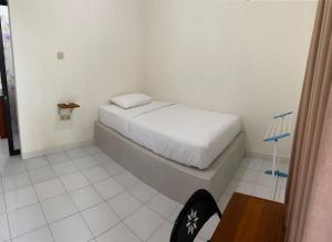 Postel nebo postele na pokoji v ubytování Ayodhya Guesthouse