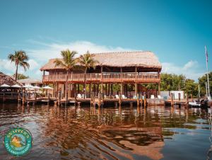 a restaurant on a dock on a body of water at Snappers Key Largo in Key Largo