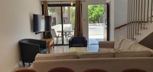 a living room with a couch and chairs and a television at Lavin - 3Bedroom Maisonette in Argaka