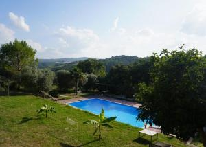 an image of a swimming pool in a yard at Eden - Nel Cuore Della Natura in Compignano +27 photos