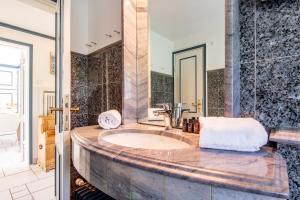 a bathroom with a sink and a mirror at Haus Südkap in Hörnum +29 photos