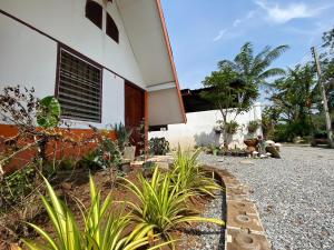 a house with a gravel path next to a house at บ้านไออรุณในฝัน ที่พักเมืองเลย วิวเขา in Ban Na Sai +23 photos