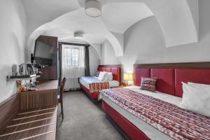 Postel nebo postele na pokoji v ubytování Hotel Nelly Kellys