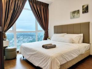 Giường trong phòng chung tại Delight Homestay Paragon Residences