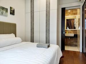 Giường trong phòng chung tại Delight Homestay Paragon Residences +78 ảnh