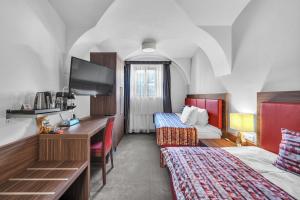 Postel nebo postele na pokoji v ubytování Hotel Nelly Kellys