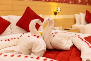 Postel nebo postele na pokoji v ubytování Hotel DSF Grand Plaza