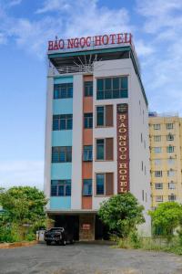 a building with a hotel sign on top of it at Bảo Ngọc Hotel in Uông Bí